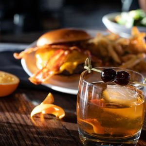 An Old Fashioned cocktail and burger at Black+Haus Tavern.